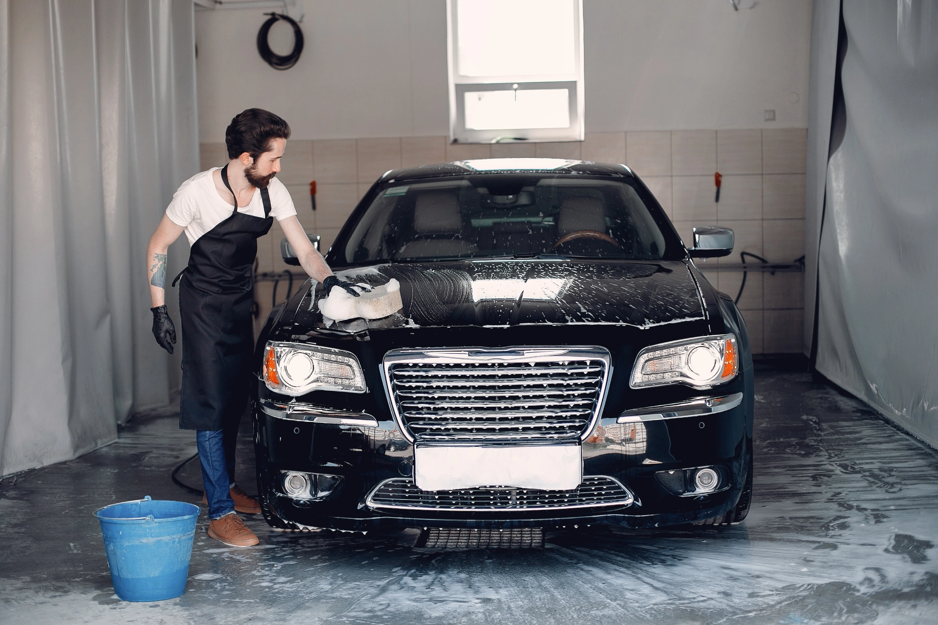 man-washing-his-car-garage (1)